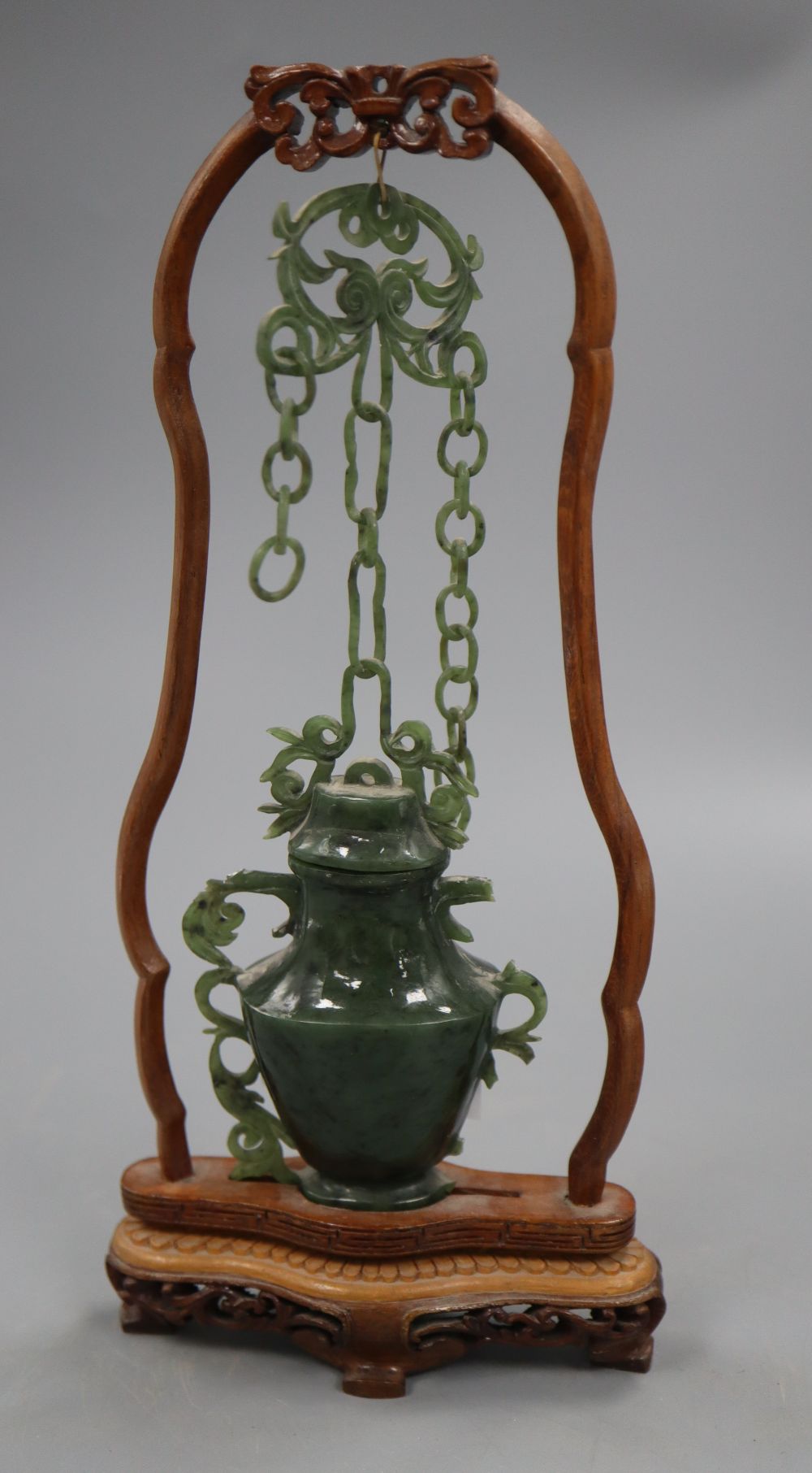 A jade vase on stand